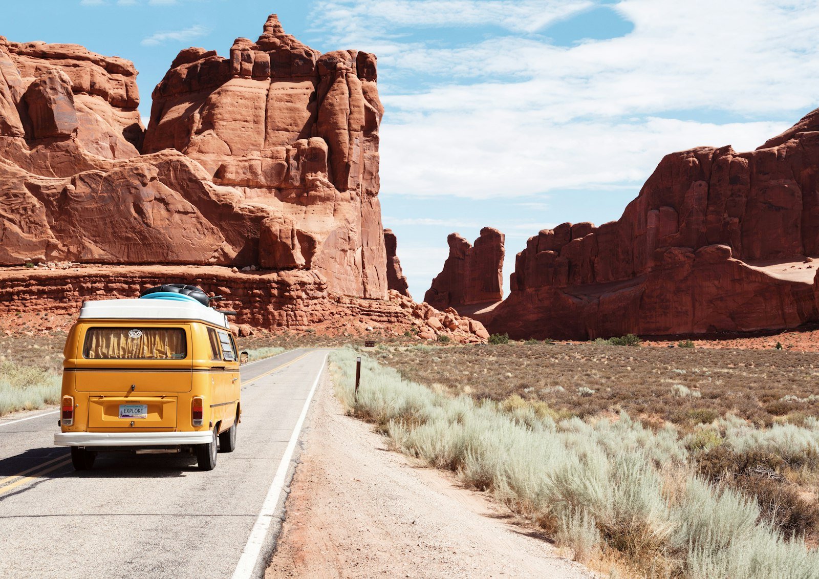 Scenic open-road journey through a dramatic travel landscape