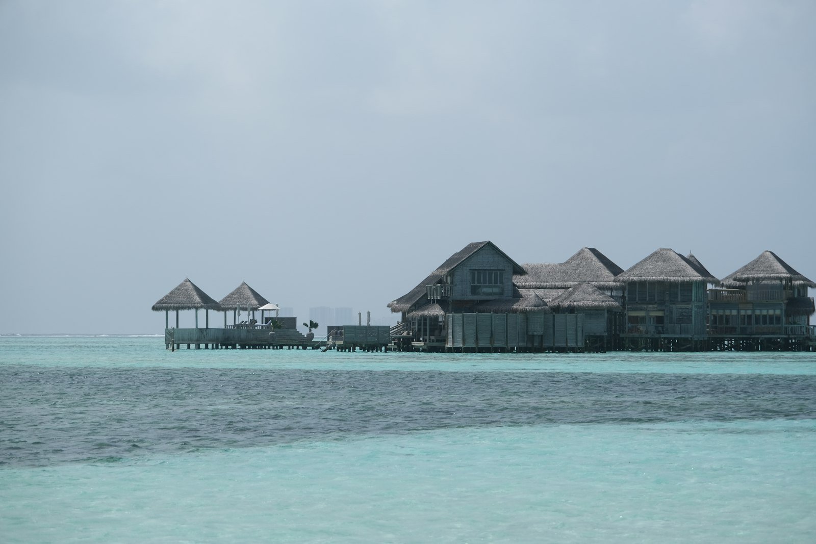 Luxury overwater villas above turquoise sea in the Maldives