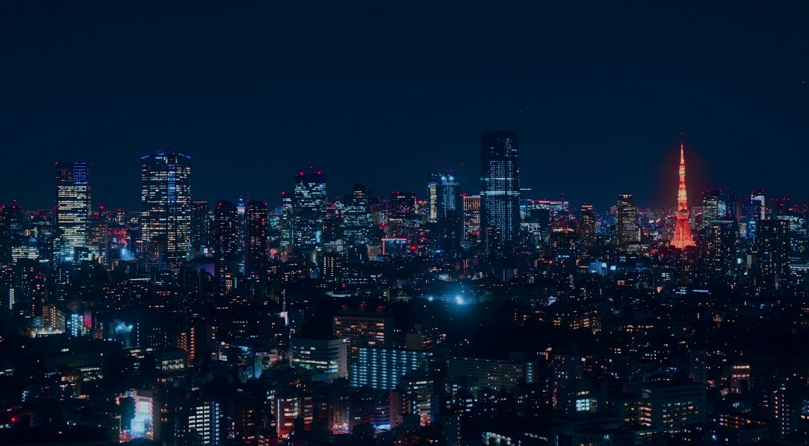 Tokyo Tower glowing above the Japanese capital at night