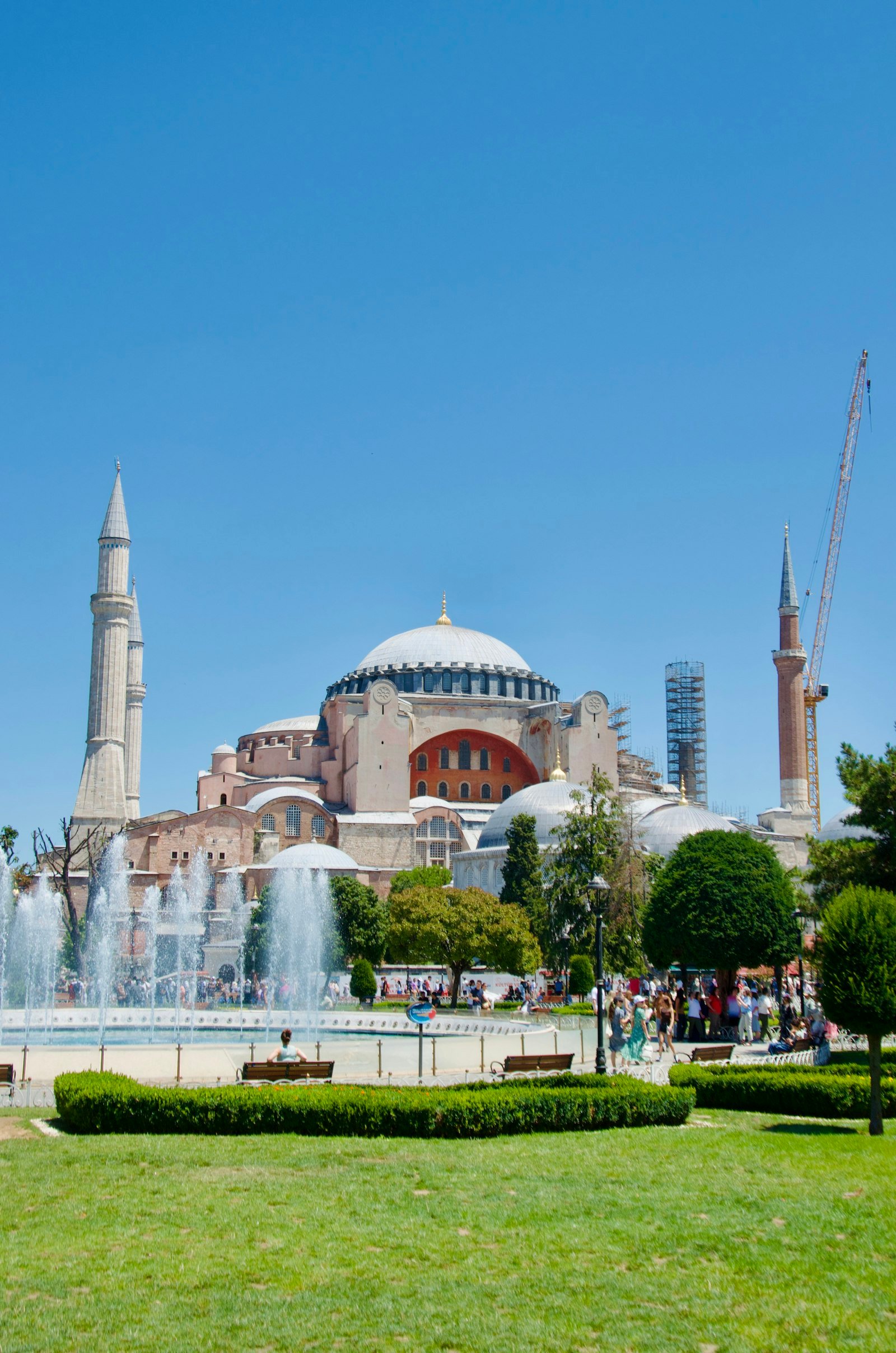 Hagia Sophia with fountains beneath a clear blue sky in Istanbul