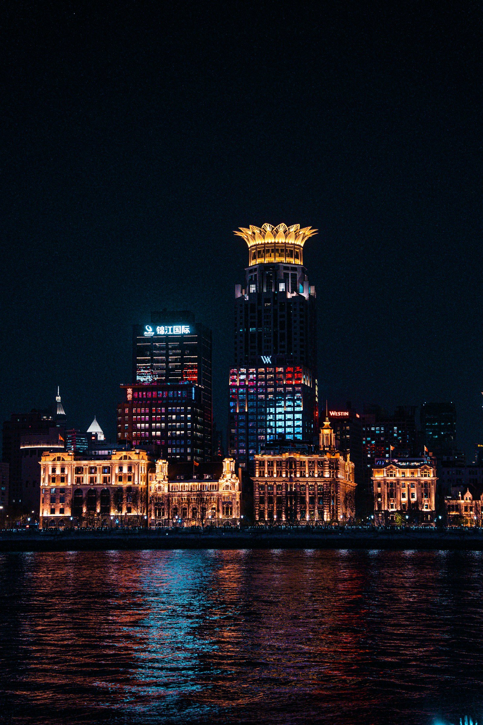 Modern Shanghai cityscape illuminated after dark, China