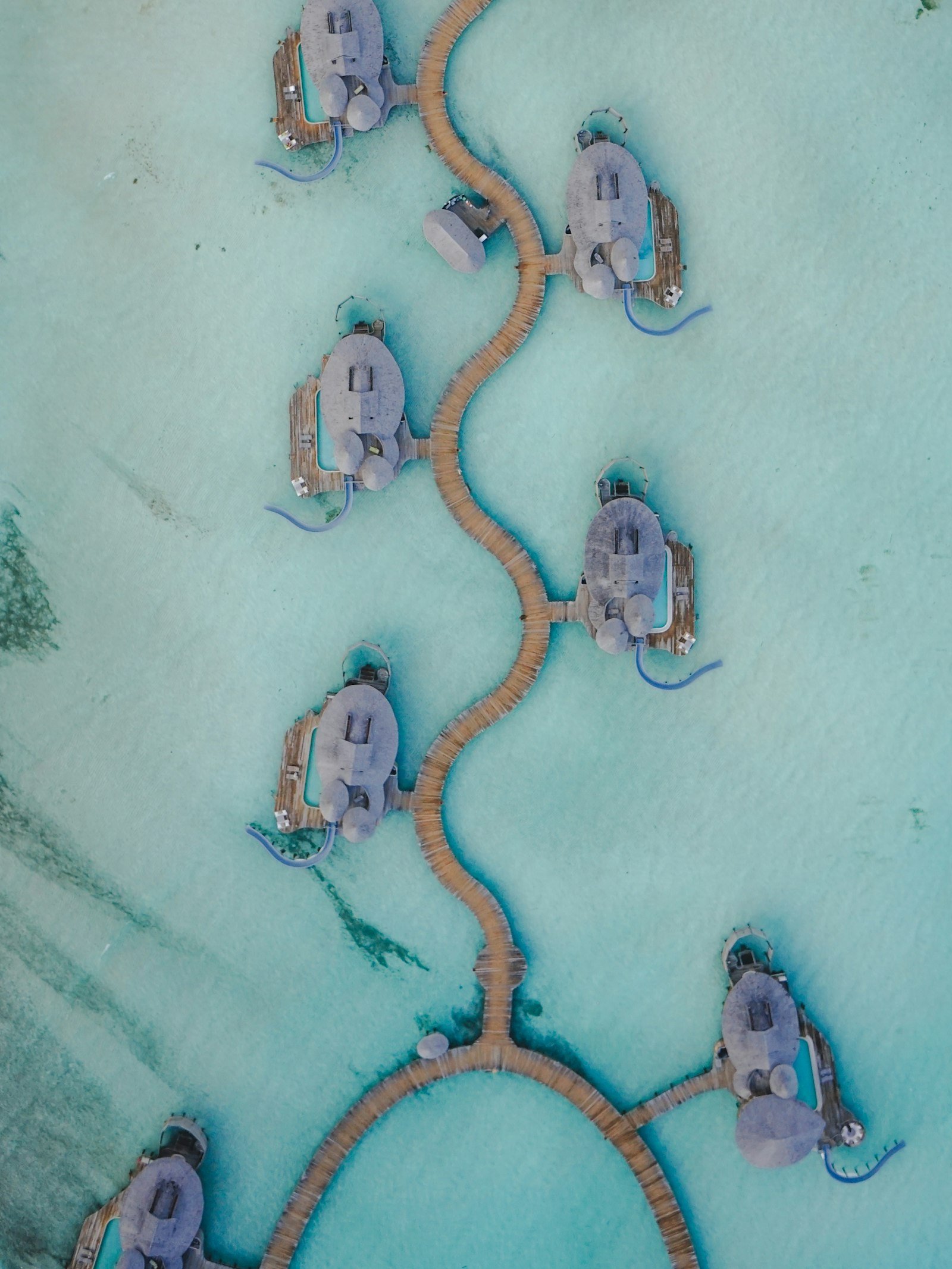Curving overwater villas at Soneva Jani in Noonu Atoll, Maldives