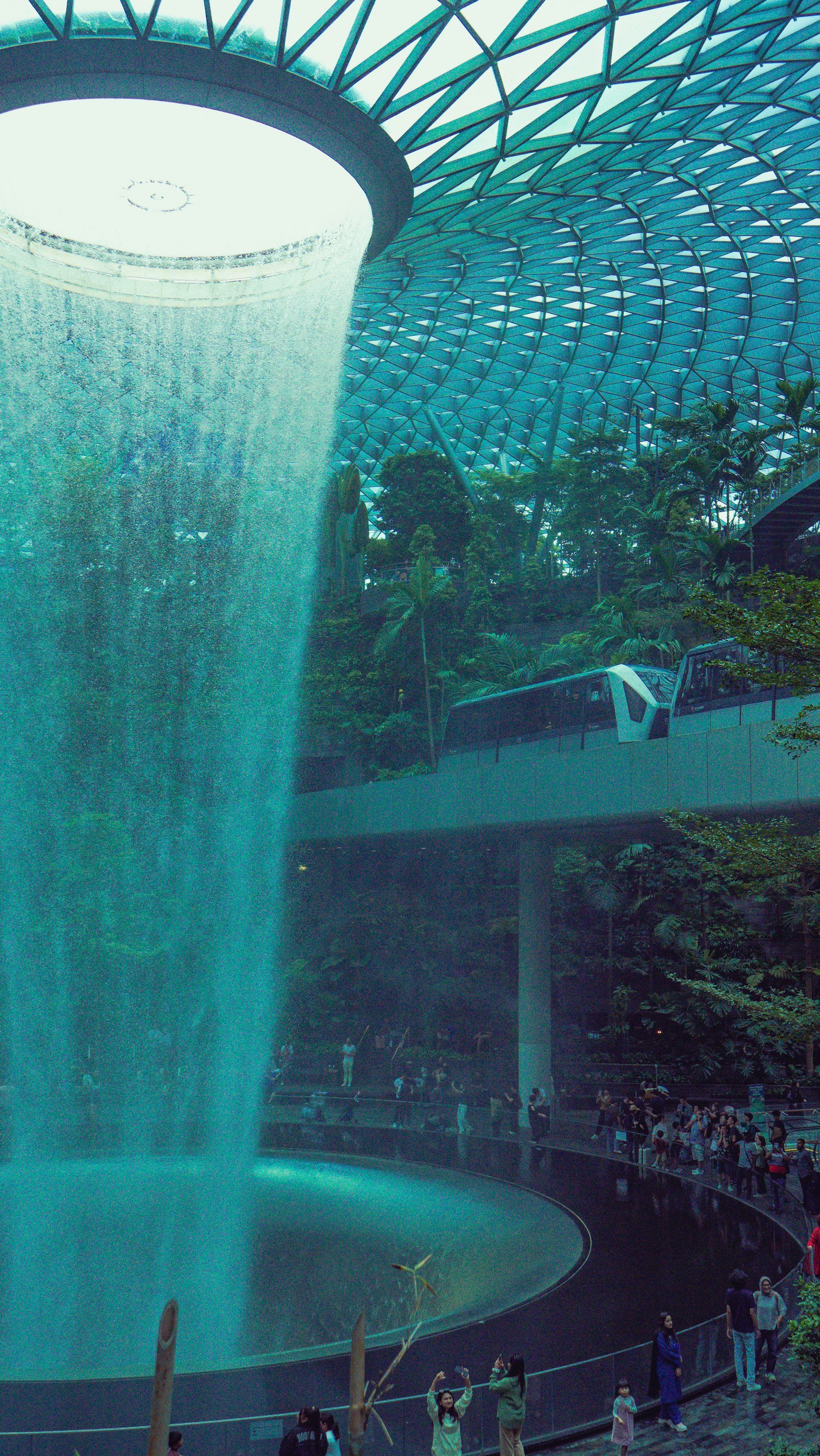 Rain Vortex surrounded by lush greenery at Jewel Changi Airport, Singapore